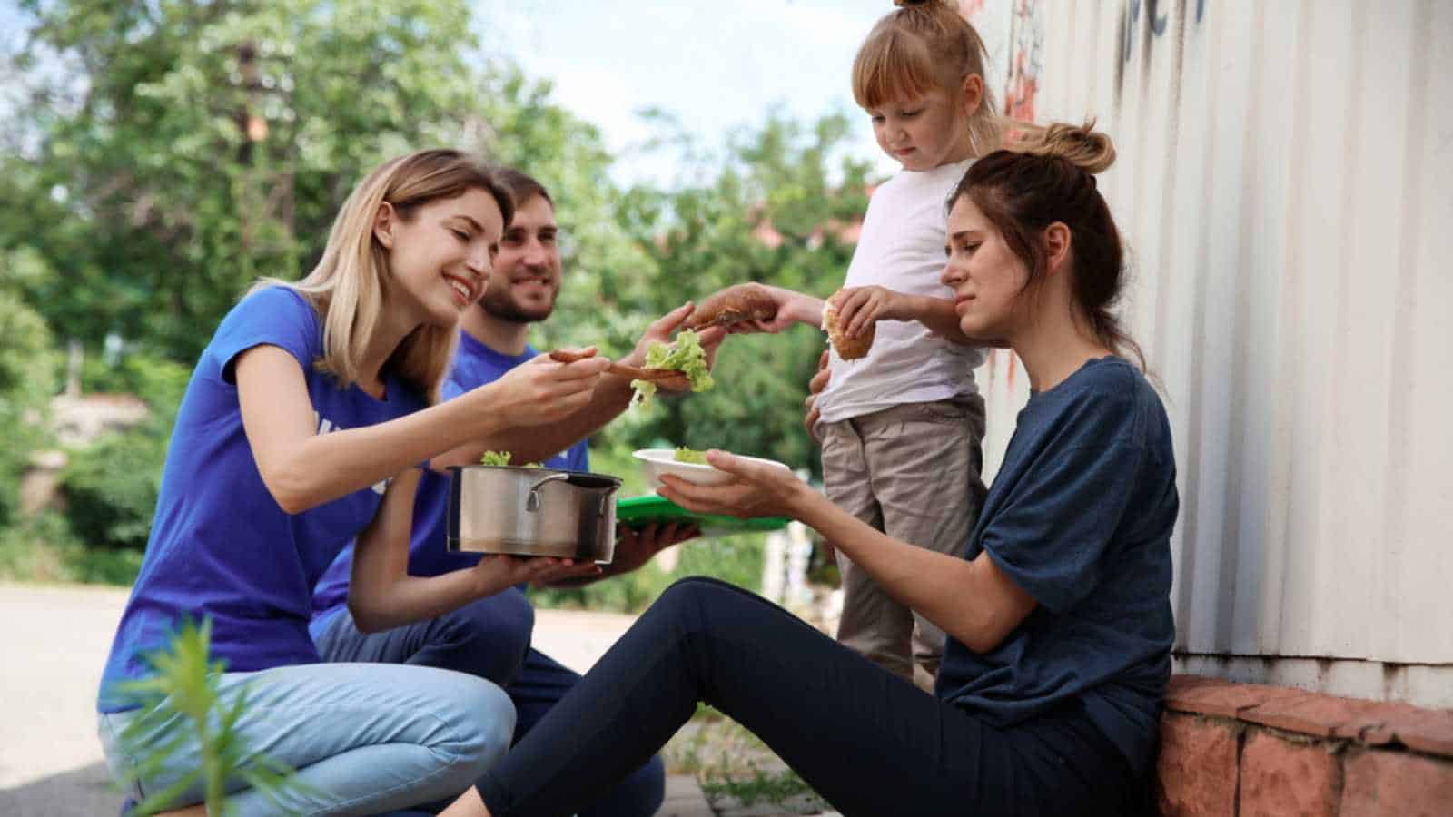 Two couples helping the poor and needy