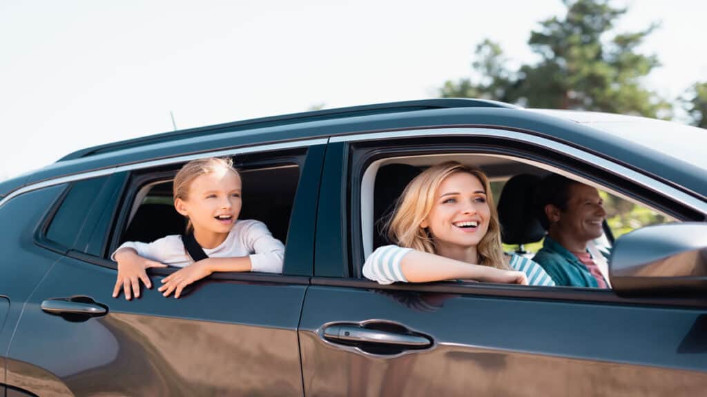family riding in suv