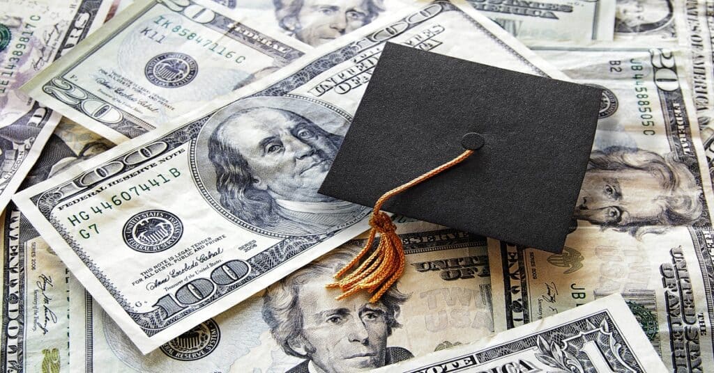 graduation cap and money