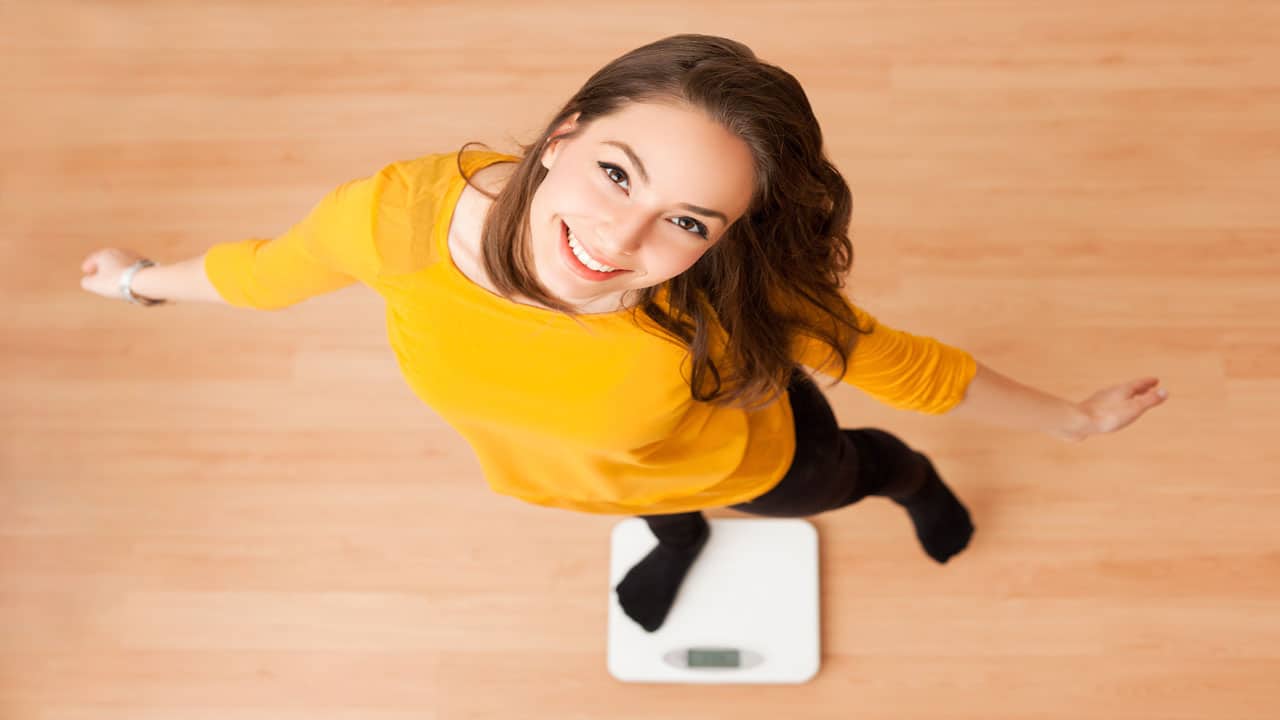 happy-woman-losing-weight