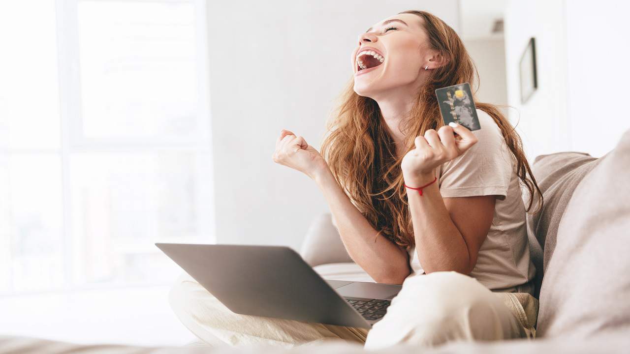happy woman with credit card
