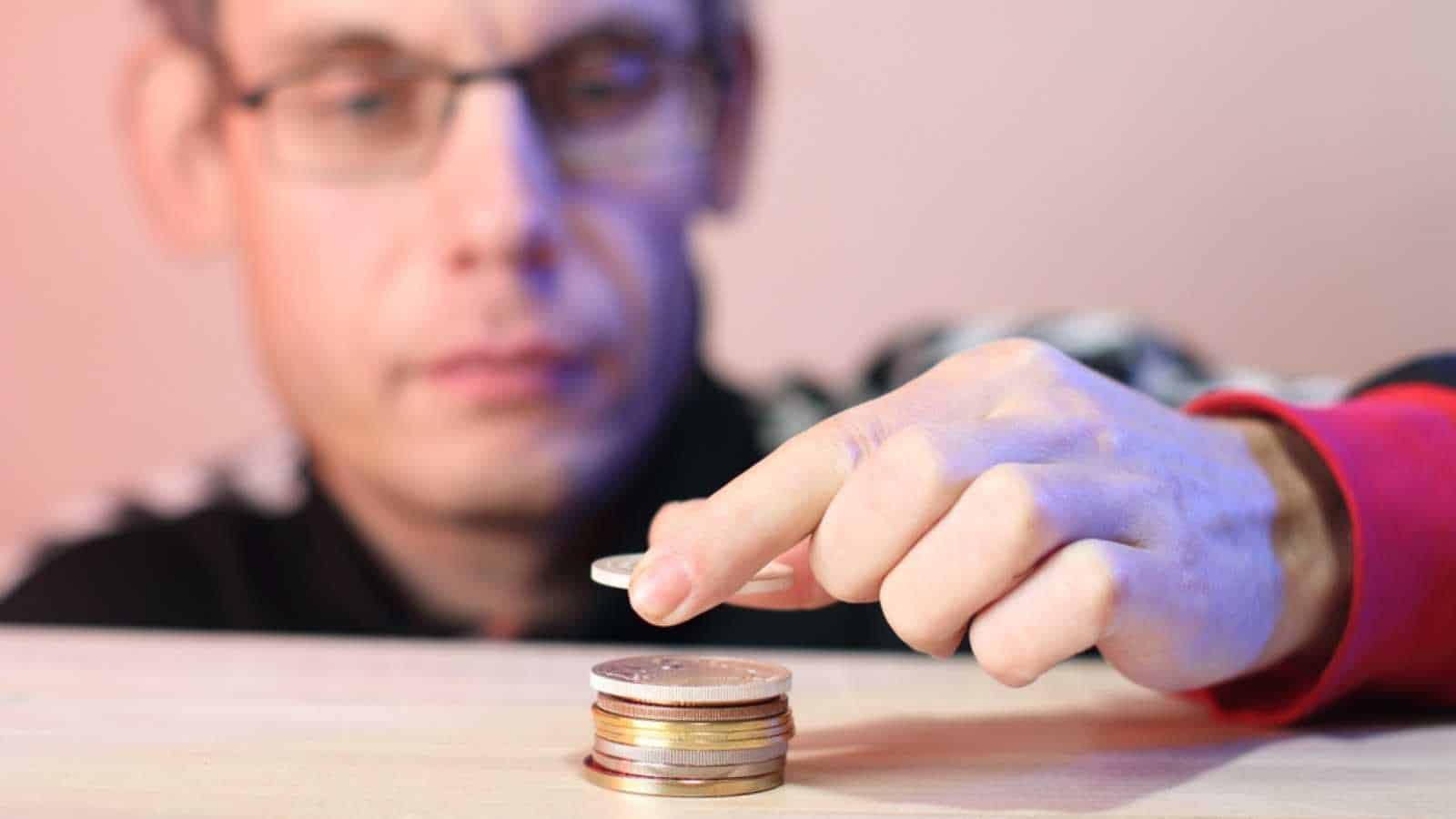 Man counting coins