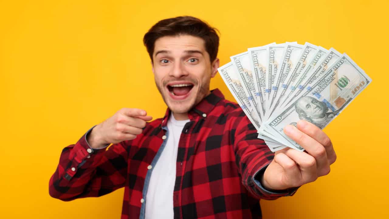man holding cash