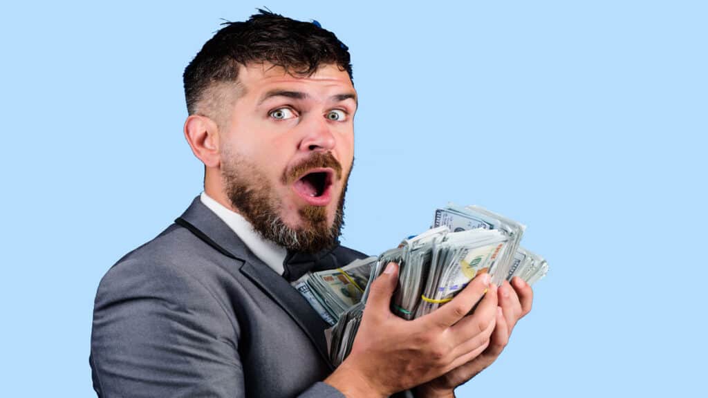 man holding pile of free paypal money