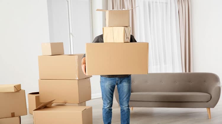 man moving boxes