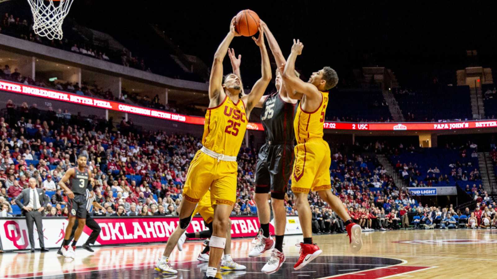 NCAA Basketballl USC vs OU, Tulsa, USA - 15 Dec 2018: USC forward Bennie Boatwright (25) grabs the rebound against OU forward Brady Manek (35) during USC-OU game.