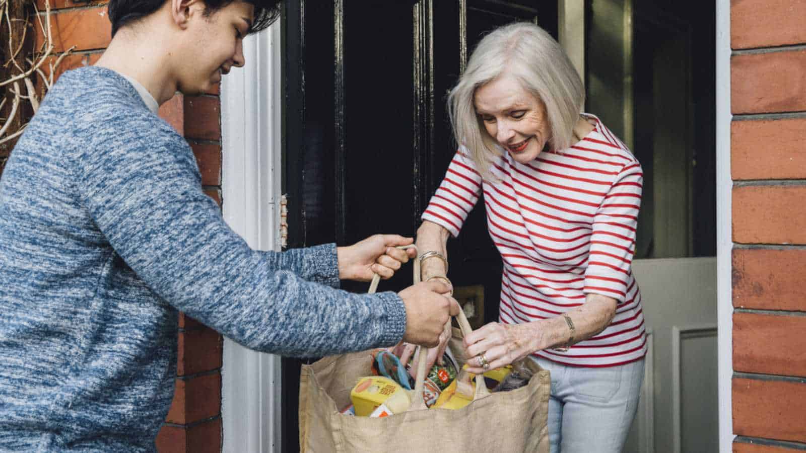 Teen helping elder neighbours