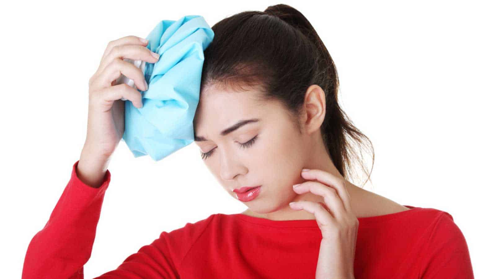 Woman applying ice pack
