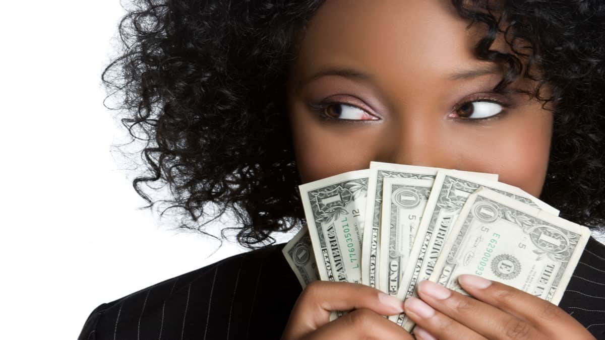 woman-holding-money-close-to-face