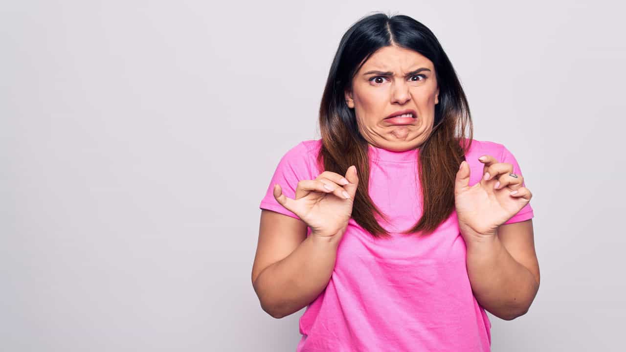 woman making gross face