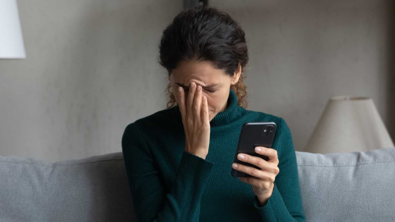 Woman on mobile stressed