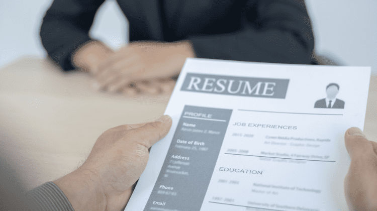 person holding resume
